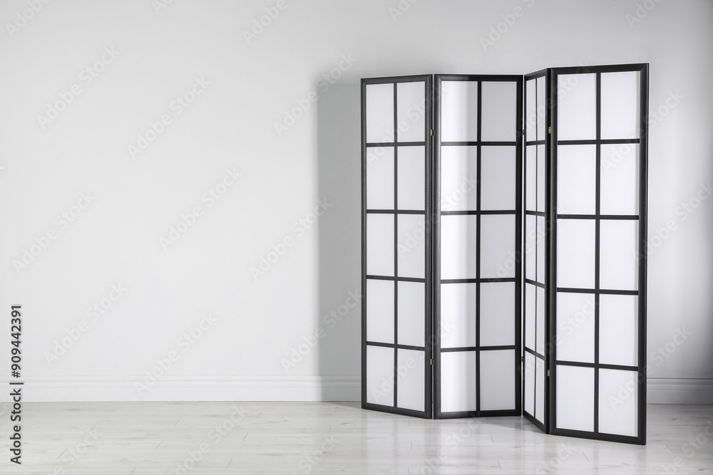 One folding screen near white wall indoors, space for text One folding screen near white wall indoors, space for text