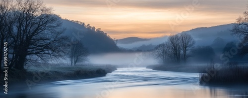 Misty river landscape at dawn with mountains and trees  tranquil and serene nature scene