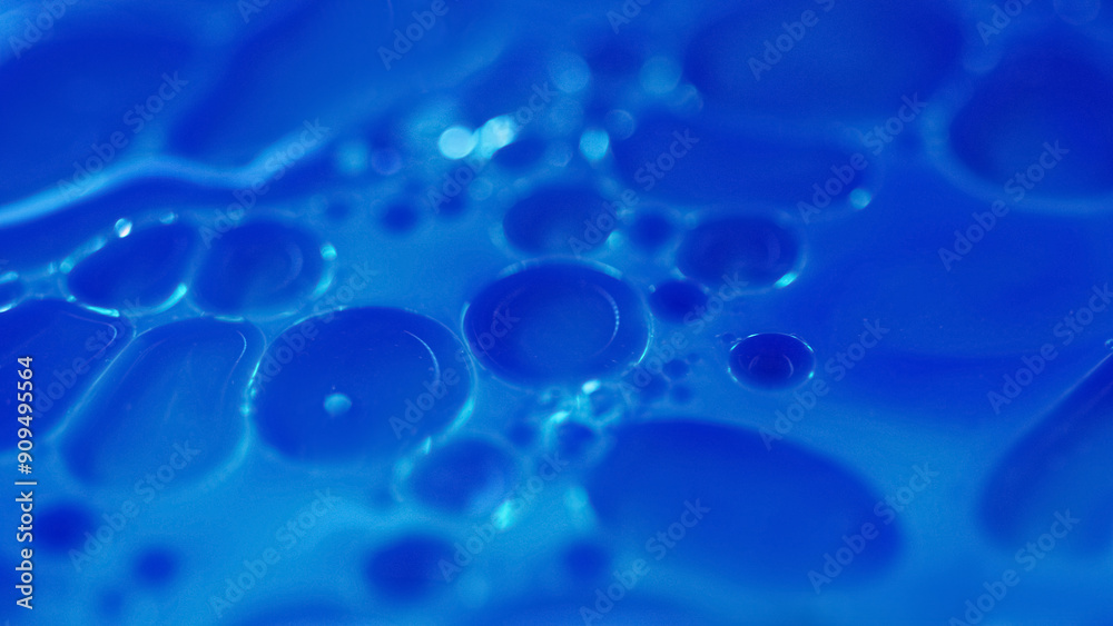 Serum bubbles. Oil fluid. Defocused blue color transparent paint water round droplets floating texture abstract art background. Serum bubbles. Oil fluid. Defocused blue color transparent paint water round droplets floating texture abstract art background.