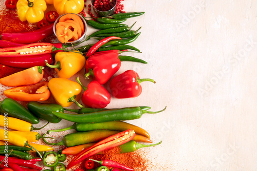 Peppers assorty on wooden background. Tasty vegetables. Colorful organic food photo