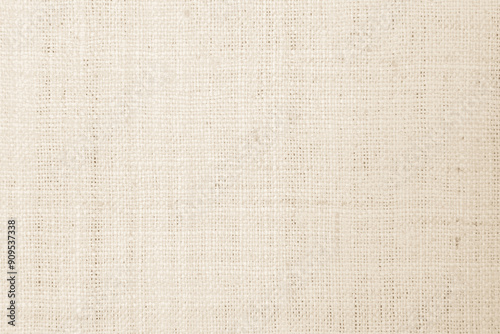 Closeup detail of beige fabric texture background. High resolution photo.