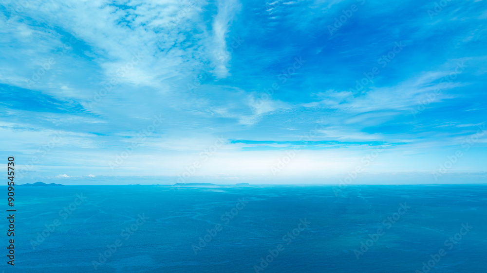 Fototapeta premium Nature of the beach and sea Summer with sunshine, sandy beaches, clear blue waters sparkling against the blue sky. On an island with good ecology and environment Background for summer vacation concept