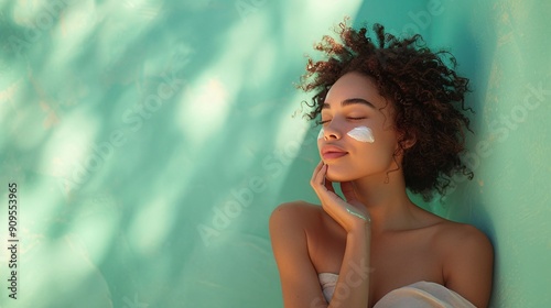 Woman with Cream on Cheeks in Tranquil Setting photo