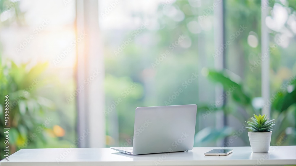 Modern Workspace Featuring Blurred Greenery Background
Modern Workspace Featuring Blurred Greenery Background