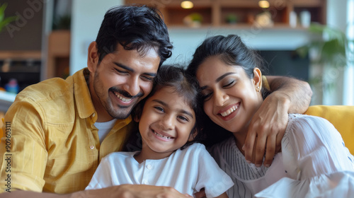 Happy indian family sitting on sofa