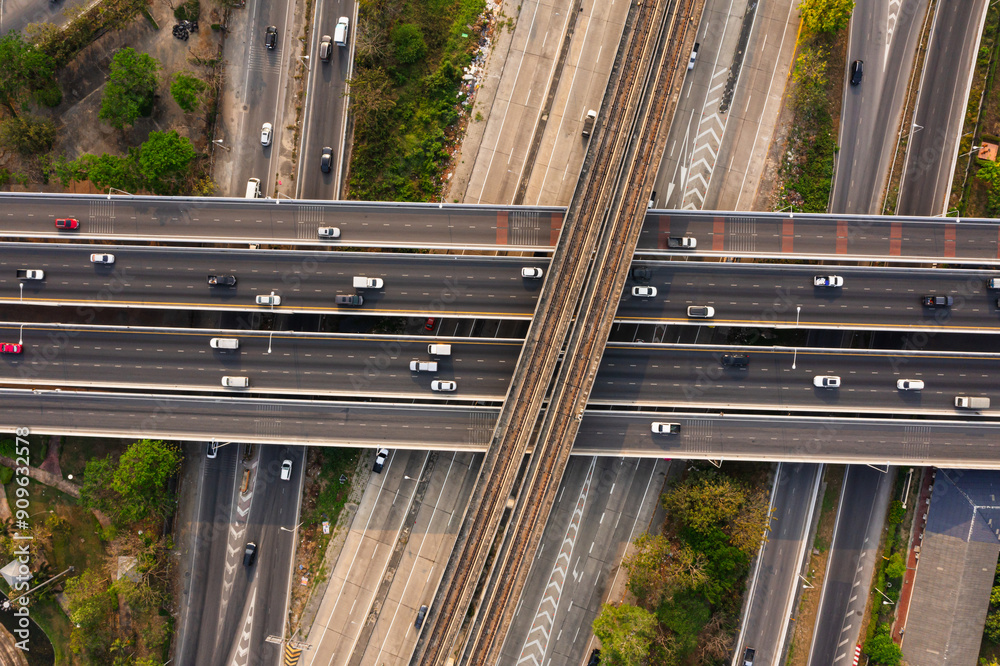 Φωτογραφία Aerial top view of railway tracks, Road traffic an important infrastructure with moving cars and railway tracks on which the train rides in Bangkok Thailand