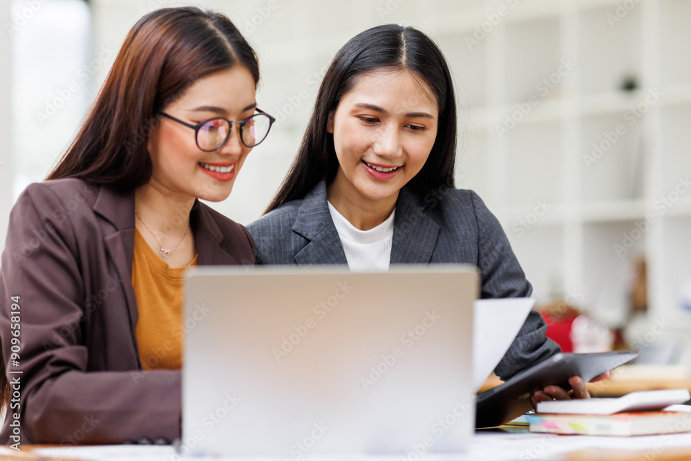 Banking business, finance and investment concept. Business asian women analyzing market data, financial graph report, economic growth, business strategy, planning and solution, risk management Banking business, finance and investment concept. Business asian women analyzing market data, financial graph report, economic growth, business strategy, planning and solution, risk management