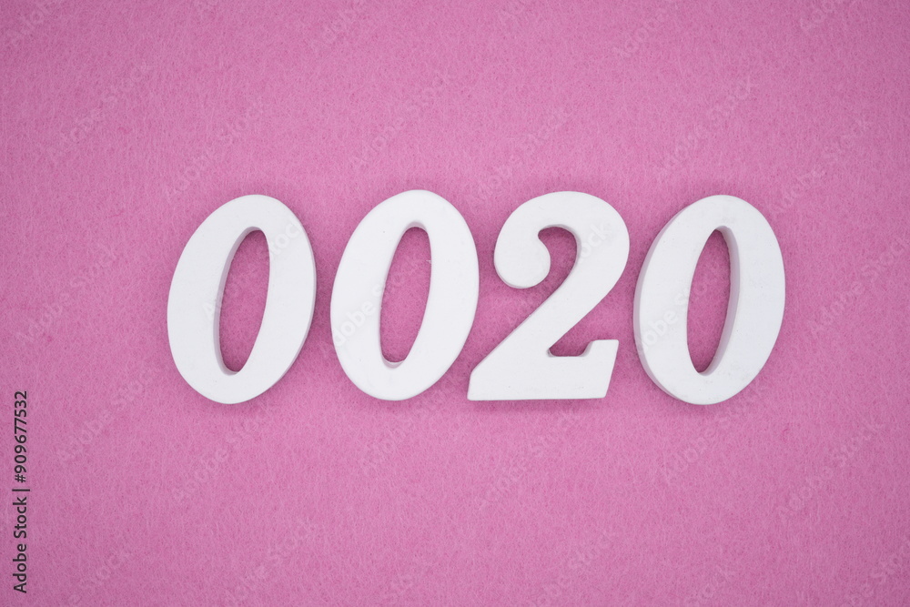 The numbers are made of white painted wood. Laying on the floor was pink paper. The numbers are made of white painted wood. Laying on the floor was pink paper.