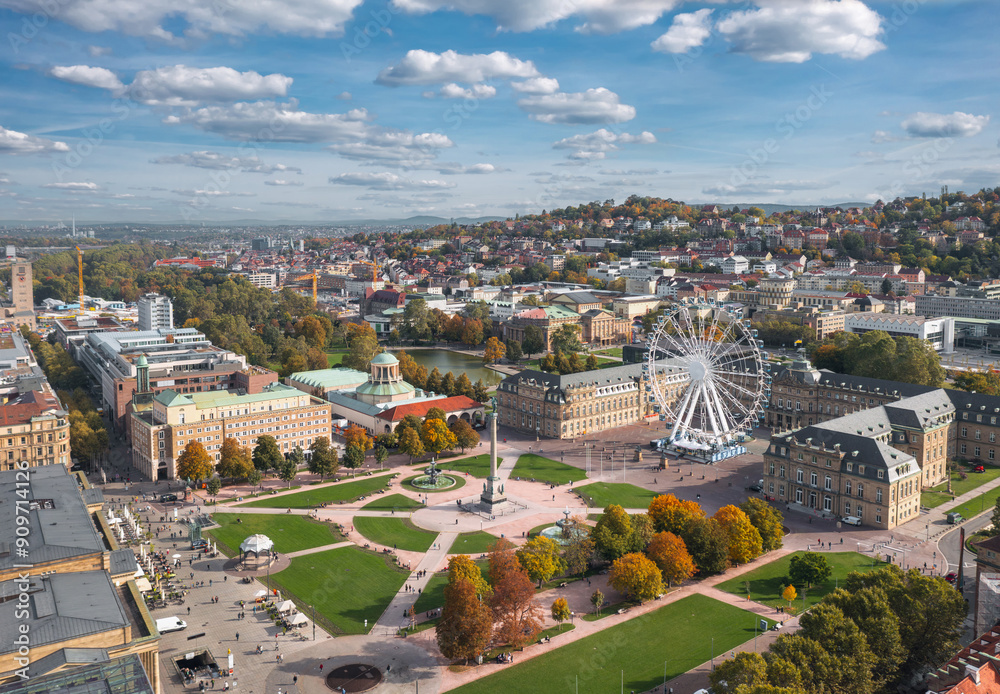 Beautiful autumn skyline cityscape of Stuttgart Mitte, Baden-württemberg, Germany at sunset. Ferris wheel and Jubiläumssäule at Schlossplatz in front of Neues schloss