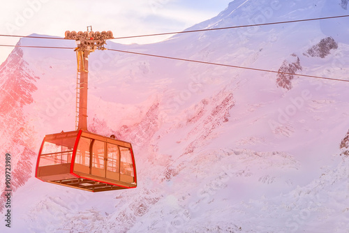 Cable car and pink sunset snow mountains panorama of French Alps near Chamonix Mont-Blanc, France photo