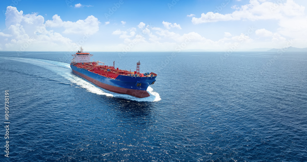 Aerial view of a heavy crude oil tanker traveling with speed over the ocean