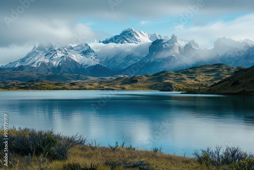 Picturesque mountain range and lake landscape with snow-covered peaks