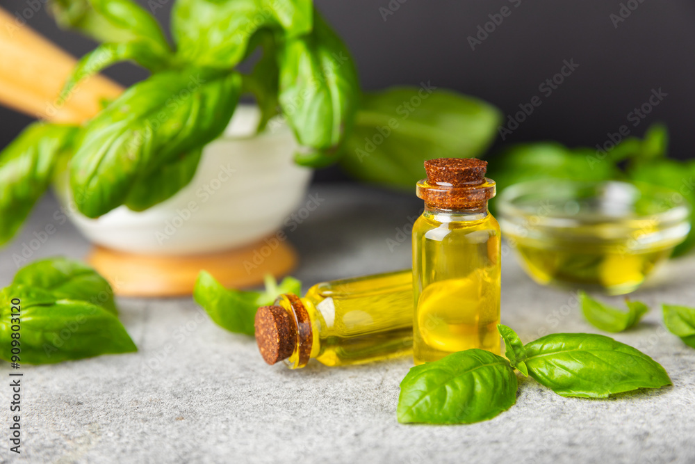 Basil essential oil on a textured wooden background. Basil essential oil and fresh leaves. Aromatherapy. Aroma oil. Medical herbs. Alternative medicine. Place for text. Copy space. Basil essential oil on a textured wooden background. Basil essential oil and fresh leaves. Aromatherapy. Aroma oil. Medical herbs. Alternative medicine. Place for text. Copy space.
