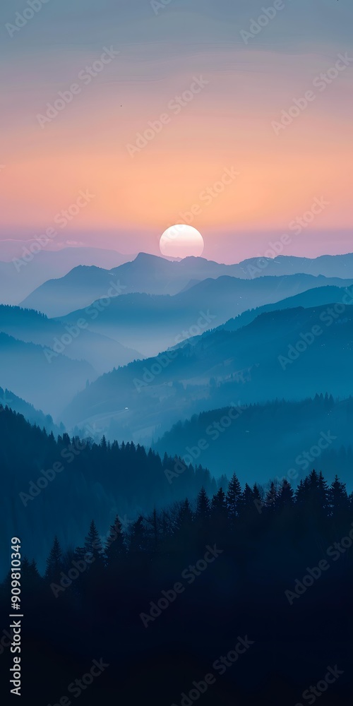 Fototapeta premium Misty Mountains at Sunset with a Sun in the Sky