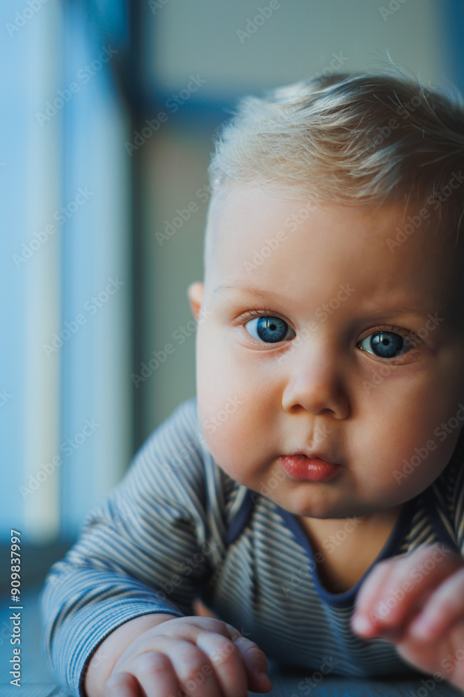 Happy smiling child. A cute little newborn baby boy with a smiling face is crawling on the floor. Motherhood baby care concept happy baby Happy smiling child. A cute little newborn baby boy with a smiling face is crawling on the floor. Motherhood baby care concept happy baby