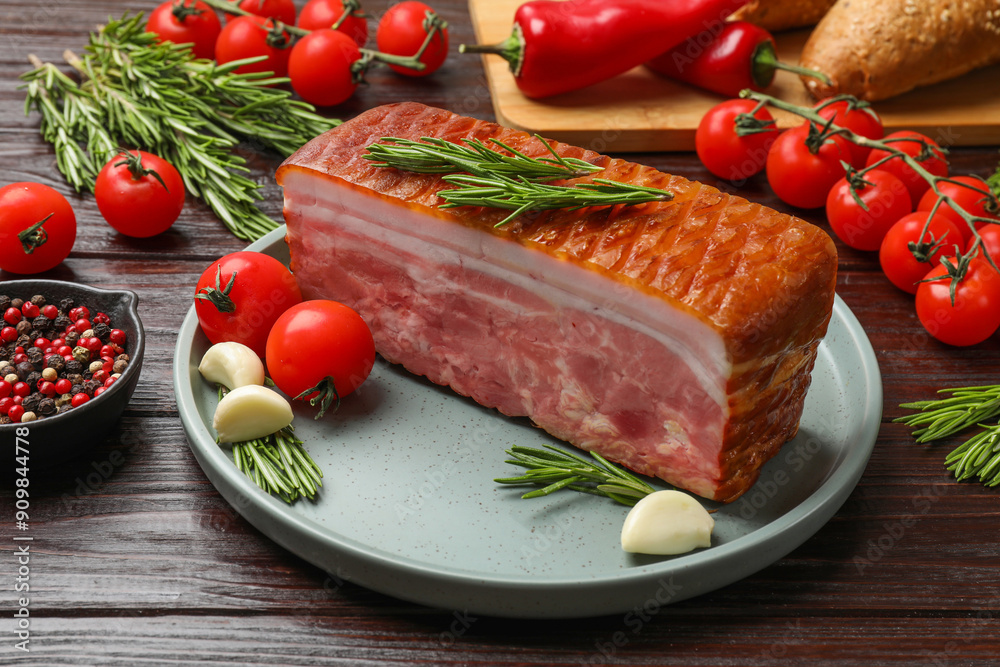 Piece of raw bacon with spices and cherry tomatoes on wooden table Piece of raw bacon with spices and cherry tomatoes on wooden table