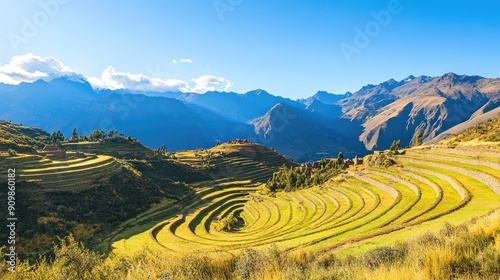 The peaceful ambiance of the Sacred Valley of the Incas, with terraced hillsides and ancient ruins under a clear blue sky. photo