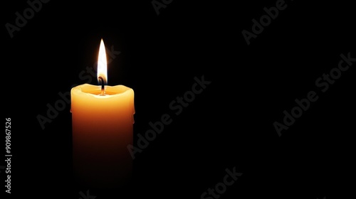A Single Candle Flame in Darkness