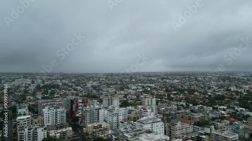 Wallpaper Mural Panoramic aerial dolly above Santo Domingo DR with storm clouds racing across sky Torontodigital.ca