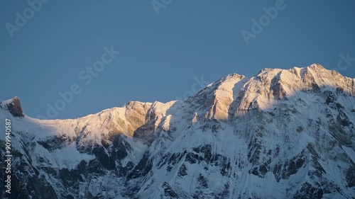 Wallpaper Mural Snowy Mountain Ridge with Blue Sky in Nepal, Snowcapped Mountains Scenery in Snow with Mountain Face in First Light at Dawn with Light on Top of Mountain in Himalayas Mountains in Nepal at Annapurna Torontodigital.ca