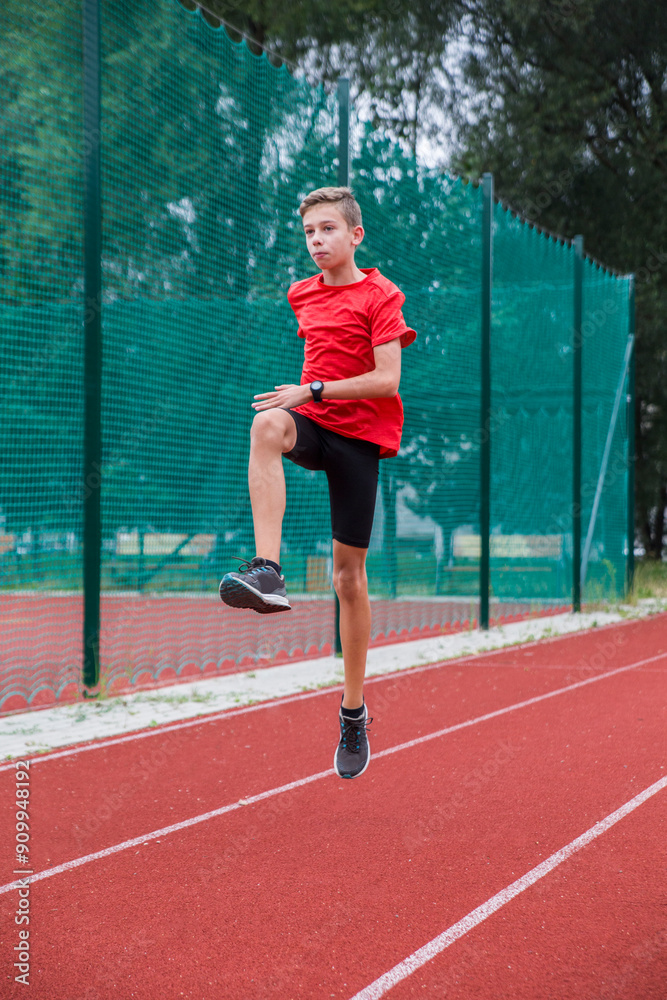 An athlete performs special running exercises at the stadium. An athlete performs special running exercises at the stadium.