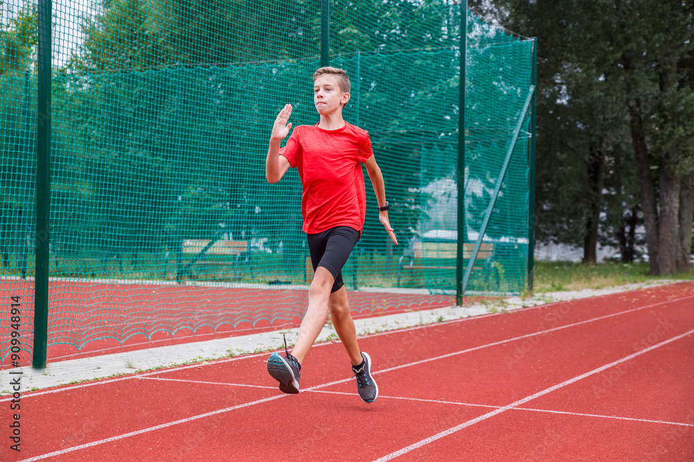 An athlete performs special running exercises at the stadium. An athlete performs special running exercises at the stadium.