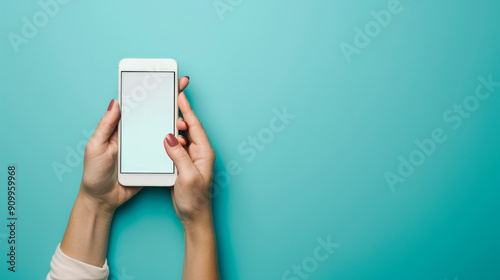 Woman holding smartphone with blank screen on turquoise background for health message photo