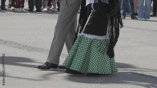 Close-up legs movement scene about a couple in the part of the Spanish Chotis event, Madrid, Spain.