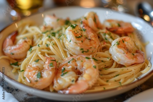 A plate of shrimp scampi, with succulent shrimp cooked in a garlic butter sauce, served over linguine