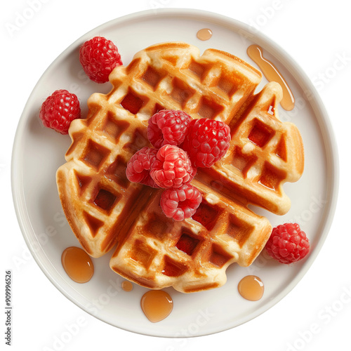 Delicious waffle breakfast with fresh raspberries and maple syrup on a white plate
