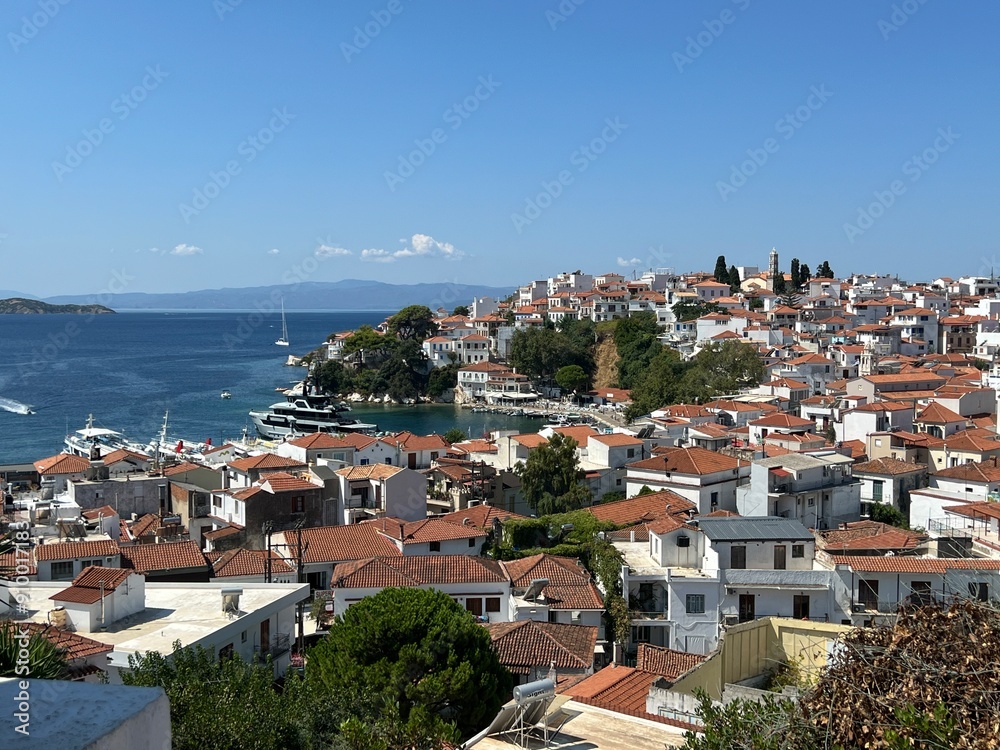Scenic Coastal Town with Red-Tiled Roofs. Greece, Skiathos Scenic Coastal Town with Red-Tiled Roofs. Greece, Skiathos