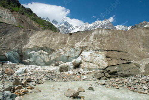 Ushba Chalaadi Glacier. Samegrelo-Upper Svaneti, Georgia.Snowy mountains of Mestia Svaneti in a sunny white cloudy weather.
 photo