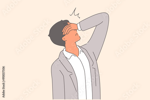 Desperate man makes face palm gesture, demonstrating hopelessness due to difficult life situation