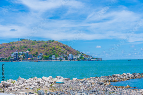Panoramic coastal Vung Tau view, with waves, coastline, streets, coconut trees and Tao Phung mountain in Vietnam. Travel concept