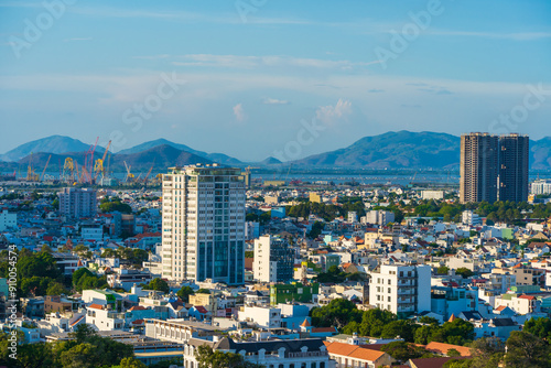 Panoramic view of Vung Tau sea from above with waves, coastline, streets, coconut trees and Tao Phung mountain in Vietnam. Travel concept photo