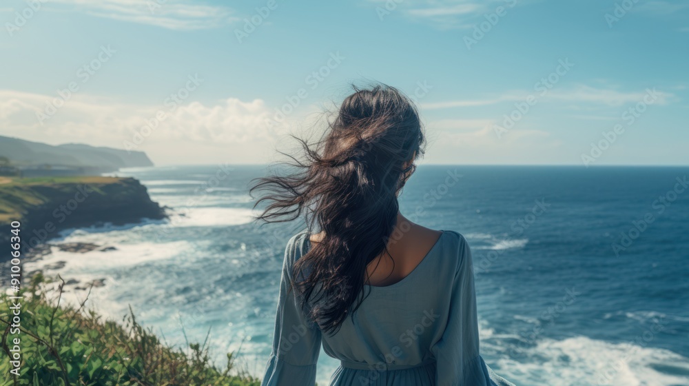 The back of a woman looking at the beautiful ocean Capture clean, The back of a woman looking at the beautiful ocean Capture clean,