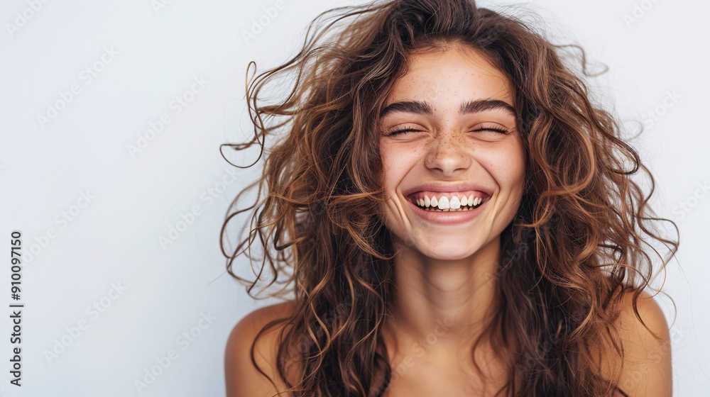 Smiling young woman with curly hair Smiling young woman with curly hair