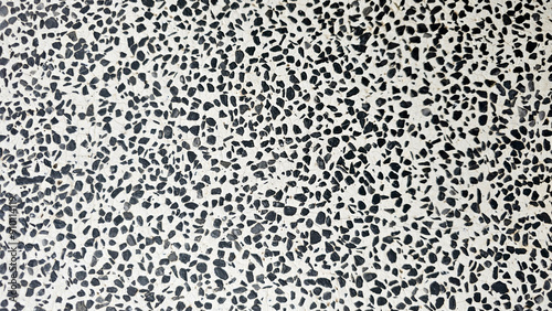 A black and white terrazzo tile pattern, showcasing its intricate and stylish design for modern interiors