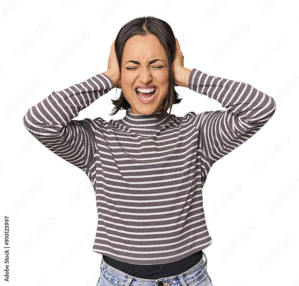 Young Caucasian woman with short hair covering ears with hands trying not to hear too loud sound. Young Caucasian woman with short hair covering ears with hands trying not to hear too loud sound.