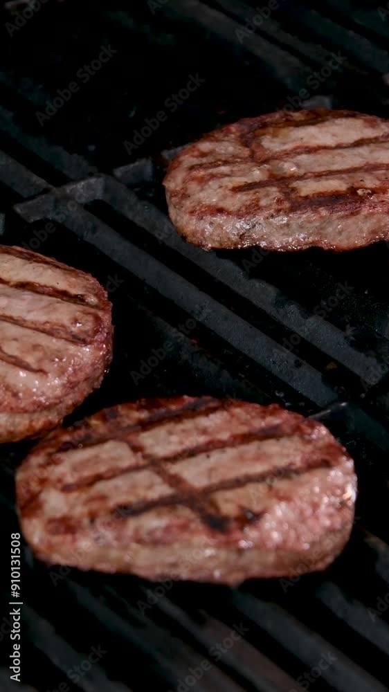 Great tasty burger close up. It is seen cutlets, onions, lettuce, crispy loaf with golden Great tasty burger close up. It is seen cutlets, onions, lettuce, crispy loaf with golden