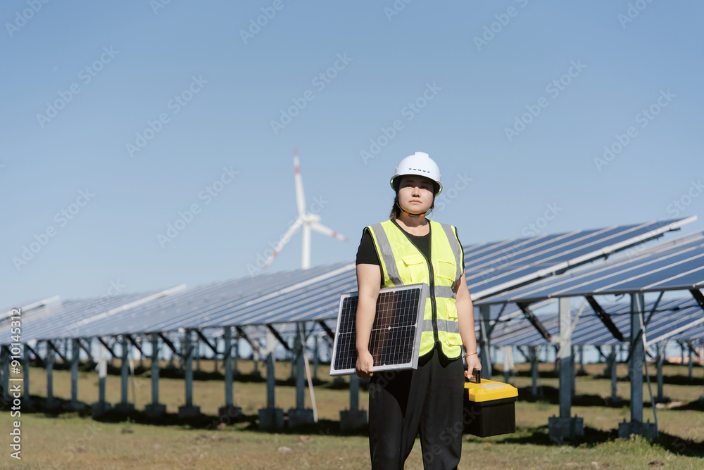 female technician working in solar power station female technician working in solar power station