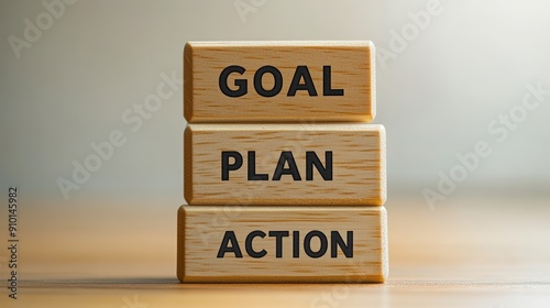 Goal plan action words on wooden blocks showing the way to achieve success