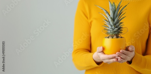 Pineapple and Lemon With Glasses Against Yellow Background