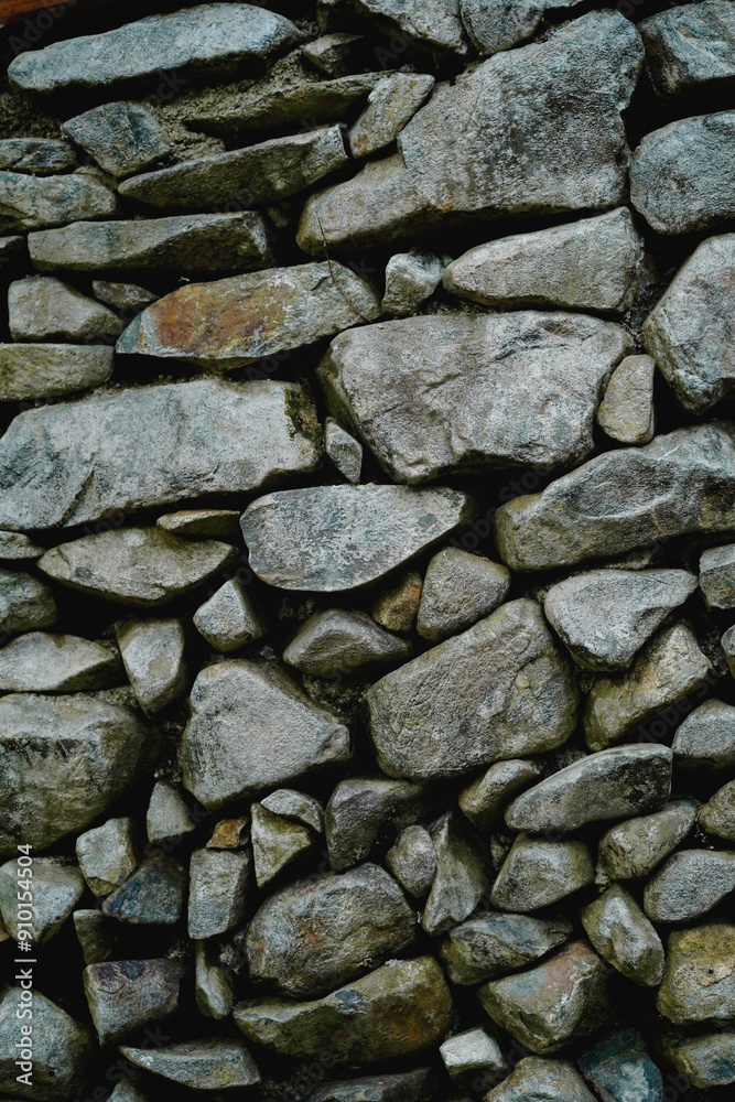Many different size of grey stone wall for abstract background and texture for interior or exterior design. Beautiful patterns, space for work, banner, wallpaper close up. Vertical. Many different size of grey stone wall for abstract background and texture for interior or exterior design. Beautiful patterns, space for work, banner, wallpaper close up. Vertical.