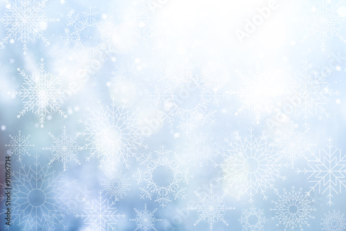 Christmas blurred background with snowflakes. Abstract blurred soft blue beautiful glowing blinking bokeh