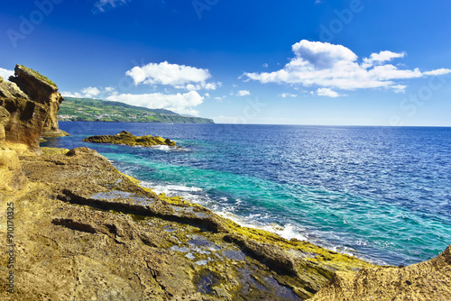 View from the inside of Islet of Vila Franca do Campo towards the eastern coast of Sao Miguel island and the atlantic ocean, on a sunny summer day.