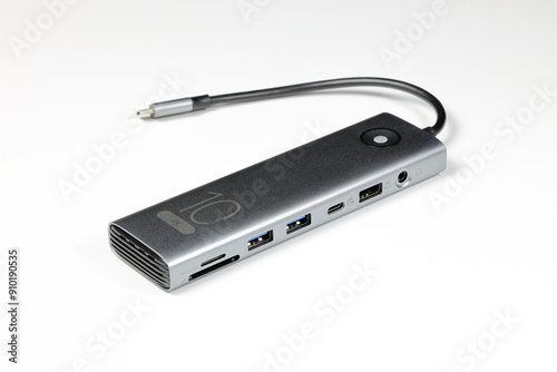 modern multifunctional adaptor or multiport docking station provide multi type of input output port for computer user - isolate on white background.
