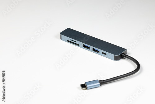 modern multifunctional adaptor or multiport docking station provide multi type of input output port for computer user - isolate on white background. 