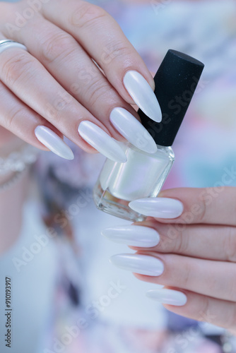 beautiful female hands with long nails light white manicure