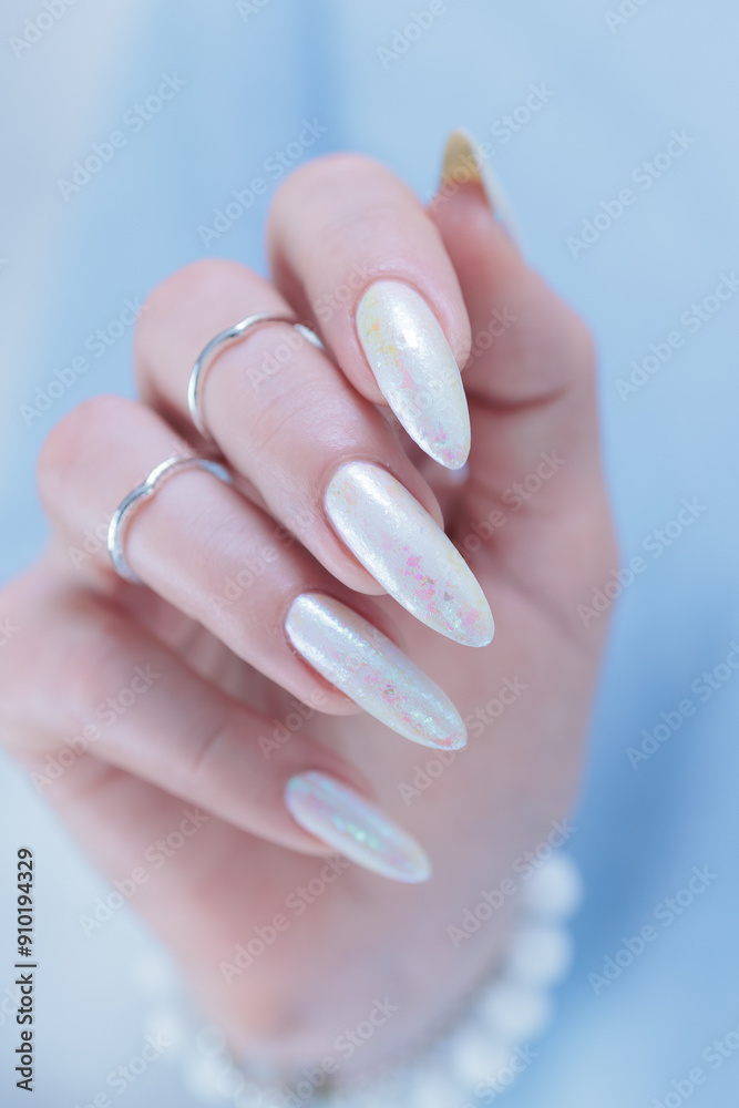 beautiful woman hands with long nails light white manicure